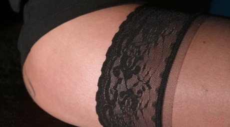 Blonde chick Frankie Filth exposes her stocking tops during a CFNM handjob