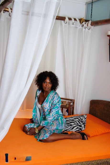Mature black woman gets totally naked while masturbating with a sex toy 93722672