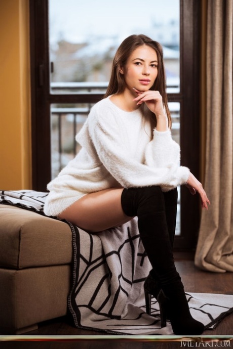 Hot teen Hilary C gets completely naked in a highly tempting manner