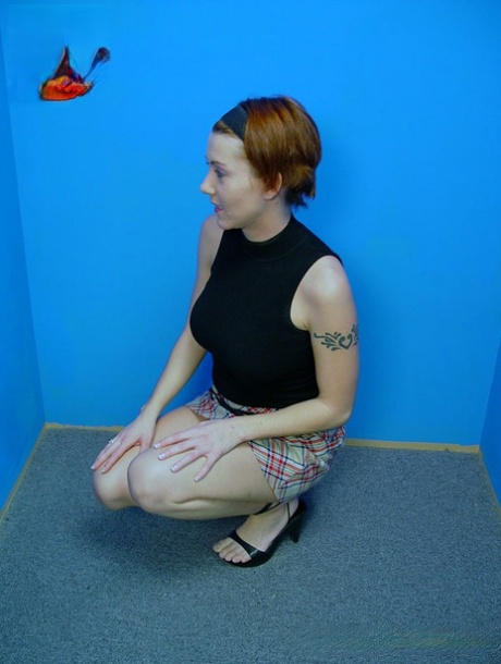 Clothed redhead swallows a mouthful of cum after sucking a BBC at a gloryhole 82396884