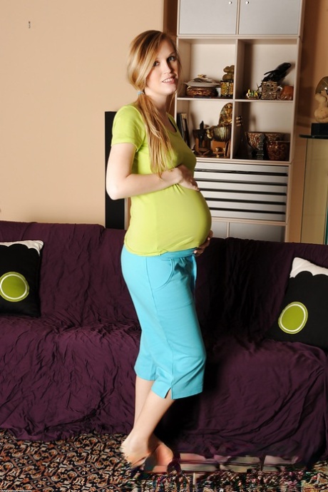Smiley pregnant amateur with puffy nipples and hairy gash getting naked 23349025