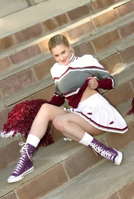 Cheerleader Anika is demonstrating her pussy without white panties 72464758
